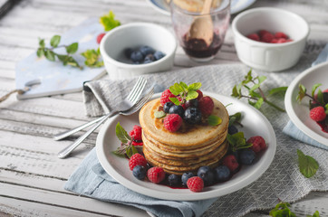 Pancakes with forest fruit sauce