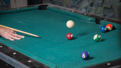 Billiards balls and cue on billiards table. Billiard sport concept