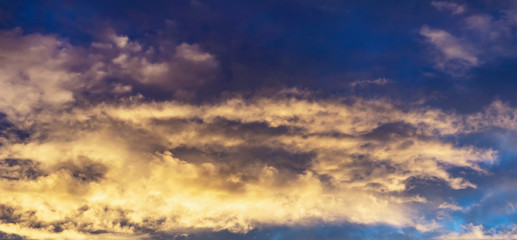 blue dark sky background with white and yellow clouds, nature series