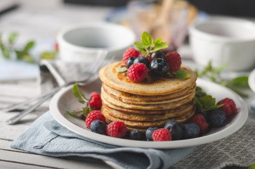 Pancakes with forest fruit sauce
