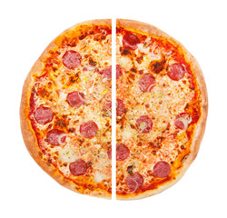 Pizza cut in two pieces isolated on white background