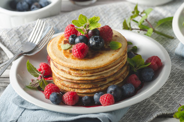 Pancakes with forest fruit sauce