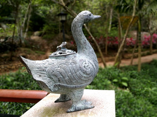 Statue of a duck and frog East landscape