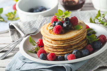 Pancakes with forest fruit sauce