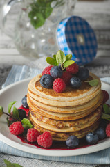Pancakes with forest fruit sauce