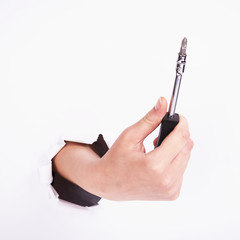 Screwdriver in the hand of the girl. Symbol of hard work, feminism and labor day. Isolate on white background.