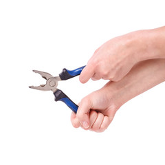 Pliers in the hand of a girl. Symbol of hard work, feminism and labor day. Isolate on white background.
