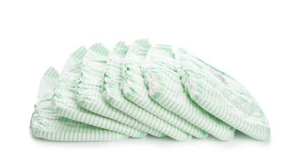 Pile of disposable diapers on white background. Baby accessories