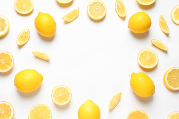 Frame made of lemons on white background, top view with space for text. Citrus fruits