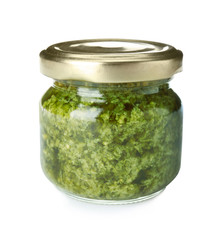 Jar of tasty pesto sauce isolated on white