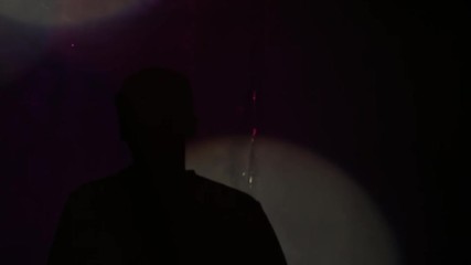 Silhouette of inspired dj artist walking on stage in colorful light. Shadow of young man against the wall. - Powered by Adobe