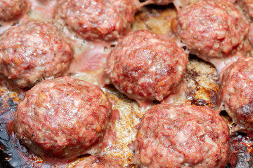 Fototapeta na wymiar Meat cutlets cooked on a baking sheet in the oven