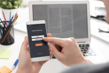 Man using mobile banking on smartphone