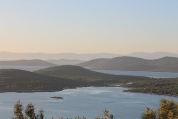 sunrise in the mountains with sea and sky