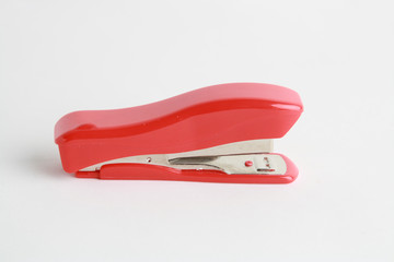 red stapler on white background