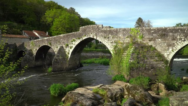 Ancient bridge of Ponte Maceira, Galicia, Spain. Antique stone bridge from 18th century. Camino de Santiago footpath
