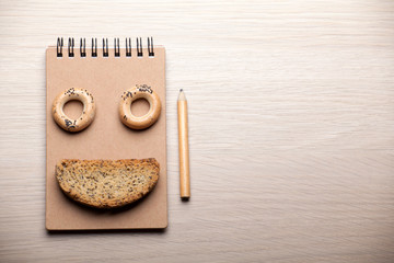 cookies notepad pencil wooden table nobody 