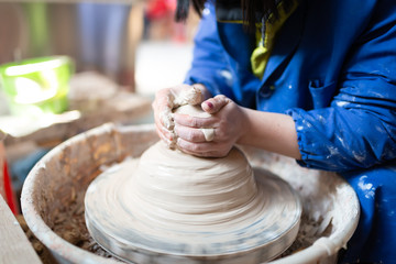 Potter making a sculpture