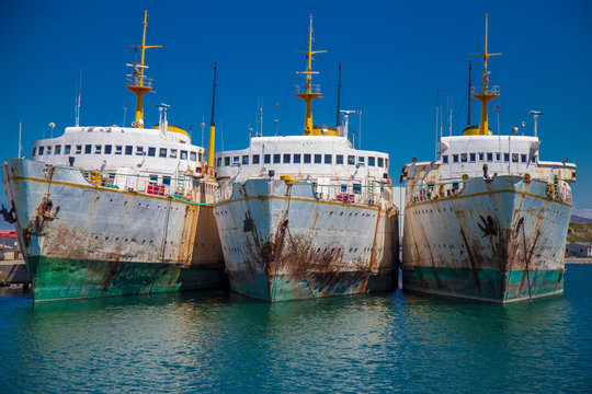 Abandoned old ships in a line