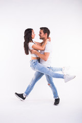 Salsa, kizomba and bachata dancers on white background. Social dance concept