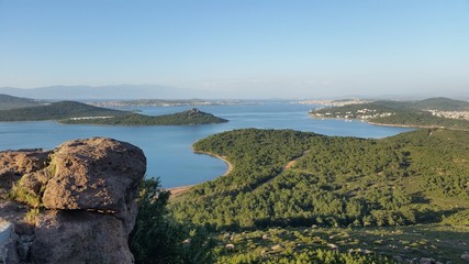 Landscape forest, sea and rock in beauty blue sky
