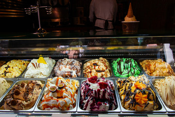 Ice cream in Rome, Italy. Italian gelateria. Ice-cream cafe, show window with sweeties.