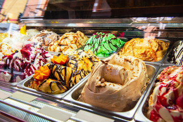 Ice cream in Rome, Italy. Italian gelateria. Ice-cream cafe, show window with sweeties.