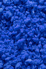 Blue background structure. Colored crumbs
