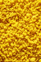 Yellow background structure. Colored crumbs