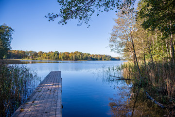 wooden plank foothpath boardwalk trampoline in the lake