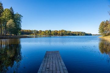 wooden plank foothpath boardwalk trampoline in the lake