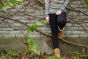 Photo of girls foot at cold day in warm clothes