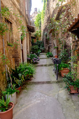 Blind alley with flowers in the old town of Sant'Agata de' Goti, Campania, Italy