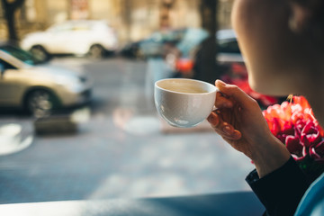 Woman drinking coffee in cafe