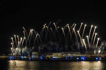 Fireworks over the river. Bright laser show. Holiday in the city.