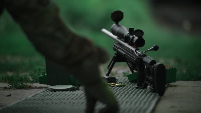Sniper takes a firing position. Slow Motion. 4K.