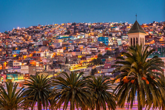 Colorful houses illuminated at night on a hill of Valparaiso, Chile