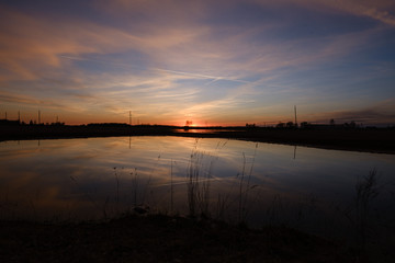 Fototapeta na wymiar colorful sunset over the lake in summer