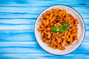 Pasta with meat, tomato sauce and vegetables