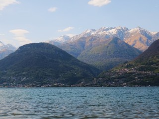 Naklejka na ściany i meble View of Lake Como and the Italian Alps on a spring day, Lombardy - April 2019