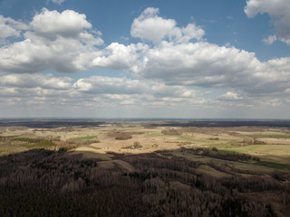 aerial view of countryside fields and forests with small lakes