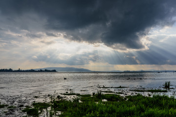 Surays are visible through the clouds