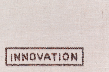 Fototapeta na wymiar Innovation sign from coffee beans isolated on linea texture bottom left.