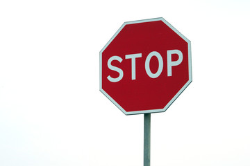 Road sign stop. Movement without stopping is prohibited. On white isolated