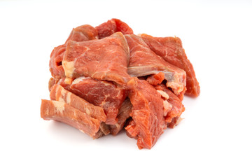 Fresh raw beef meat slices isolated over white background. Selective focus