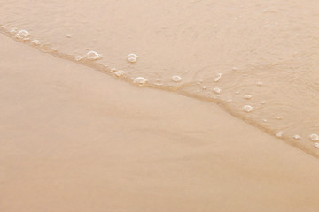 soft wave of the sea on the sandy beach.