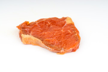 Fresh raw beef meat slices isolated over white background. Selective focus