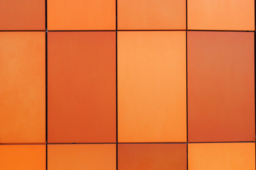 Orange Metal decorative panels for the facade of different shades. Orange texture background
