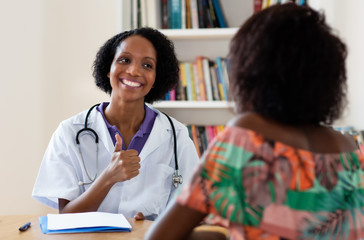 African american female gynecologist has good news for patient