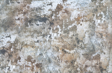 Brick wall.Old flaky paint peeling off a grungy cracked wall.Cracks, scrapes,old paint on old cement wall.Painted cement colorful background